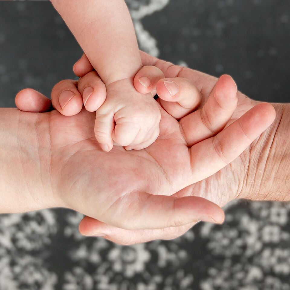 Three-hands-parents-and-kid-child.jpg